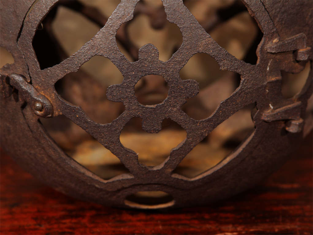 Japanese cast iron hanging lantern (tetsu toro). The spherical lantern with reticulated gourd forms at top and four circular shippo (