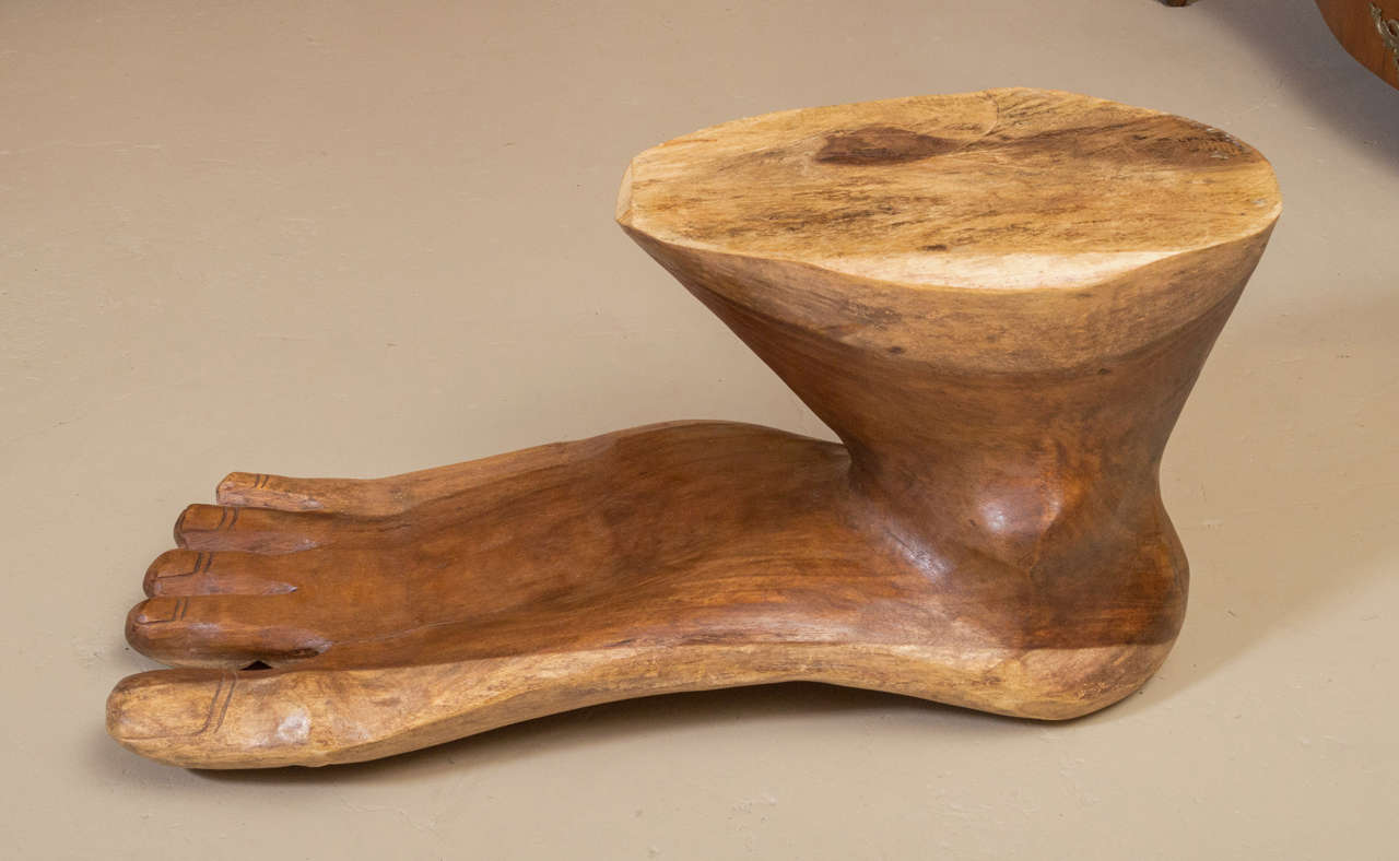 A rare and unusual Foot Sculpture in the Manner of Pedro Friedberg.  This unique sculpture is hand carved out of one, solid piece of exotic hard wood.  The iconic Sculpture can be used as a Coffee Table and would look beautiful with a glass top.  It