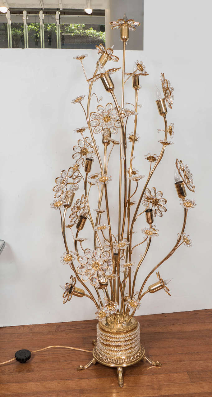 Brass floral design floor lamp with crystal flowers and details at base.