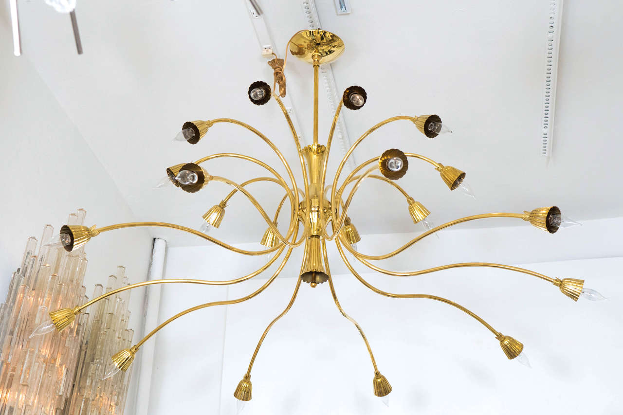 Brass two-tier chandelier with twenty curvilinear arms and fluted shade by Lumi.