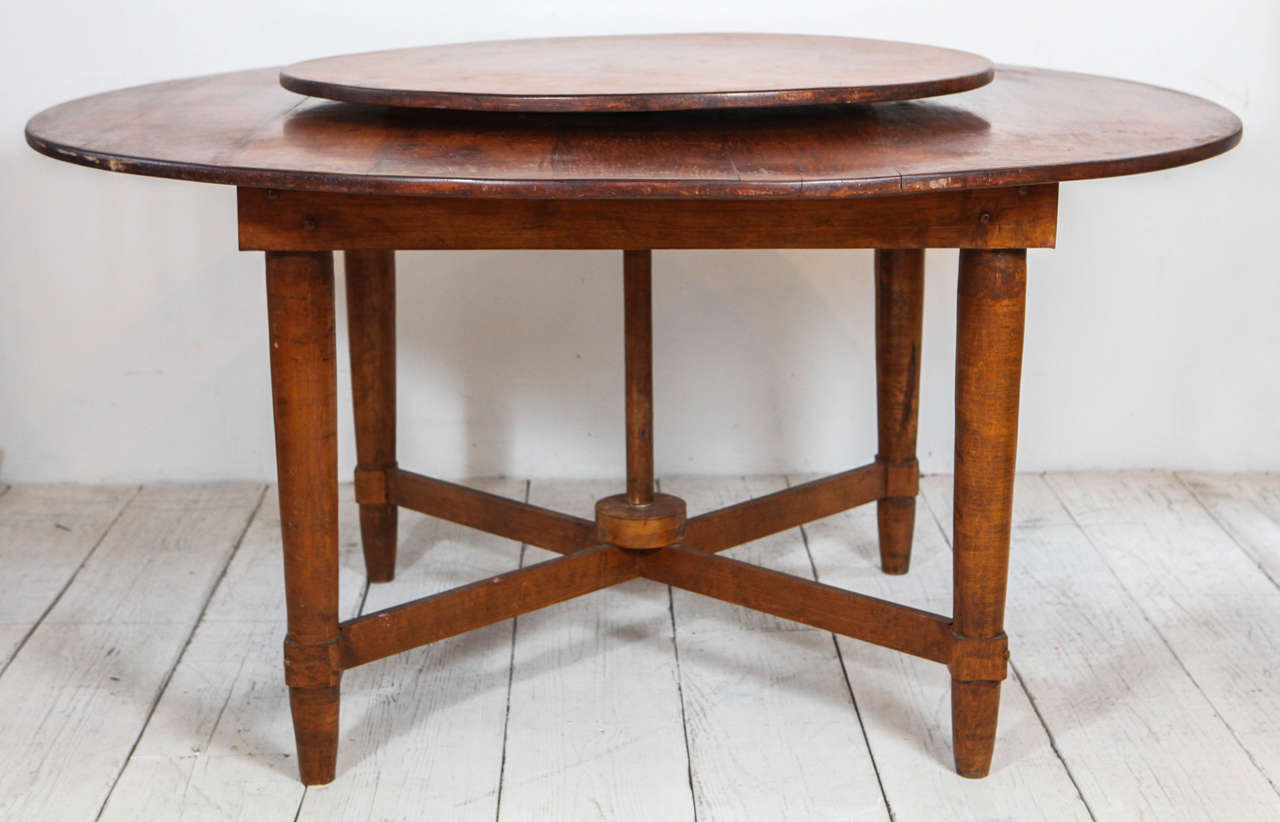Handsome farm style dining table with built in lazy susan.