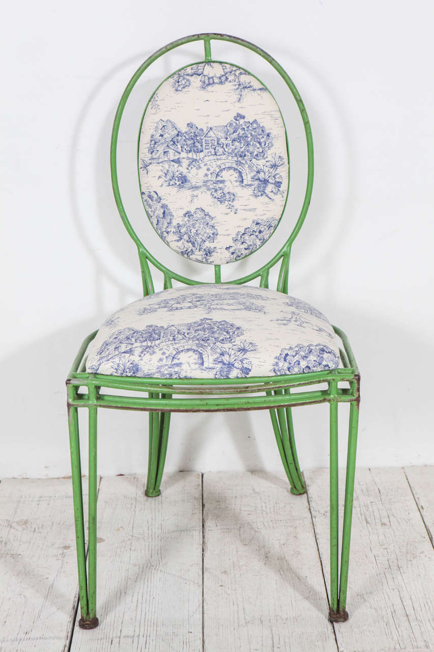 Exceptional rare and distinct dining chairs newly reupholstered in a blue and white toile. Sold individually.