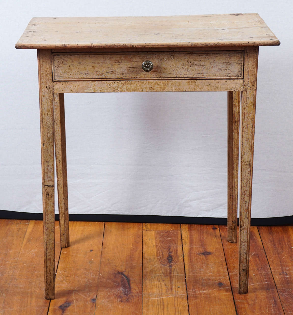 This sweet original painted small table will fit in any room. Very dainty with thin straight legs and a drawer it is a lovely butter color. Original paint makes this piece very special.