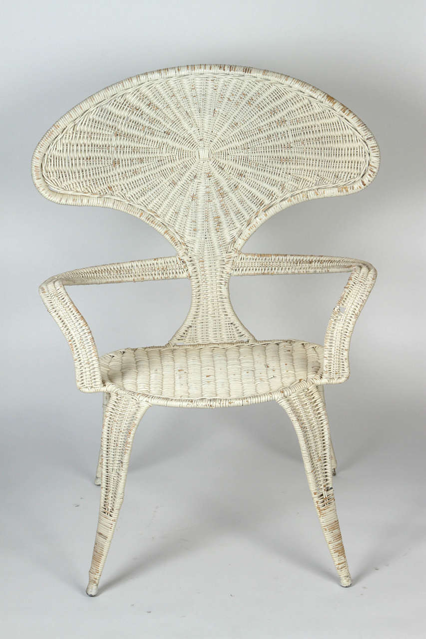 Curved woven wicker armchair by Miller Fong. Made in USA, circa 1950s.
