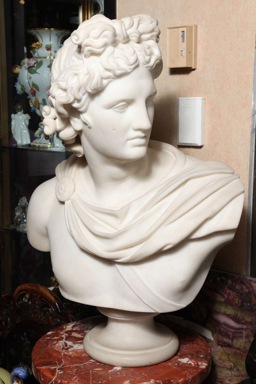 A very large and superbly hand-carved Antique Italian Carrara marble bust of APOLLO
Italian, Grand Tour period after the antique, mid 1800's.  Signed on the back