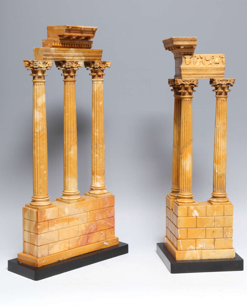 A very fine and early pair of Roman neoclassical period grand tour Sienna marble models of the Temple of Castor and Pollux and the Temple of Vespasian, early 1800s, Italian.

In the 18th and 19th century no gentlemen's education was considered