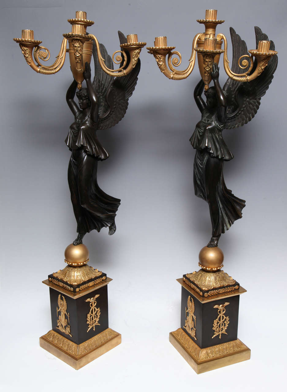 Pair of highly important & large Antique Neoclassical Period Russian Empire gilt bronze & patinated bronze figural multi arm candelabras of exquisite detail embellished with large neoclassical winged figures of women embellished on bases adorned