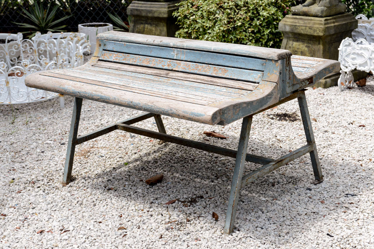 Antique wood slat double bench with iron base.  All original distressed painted surfaces as found.