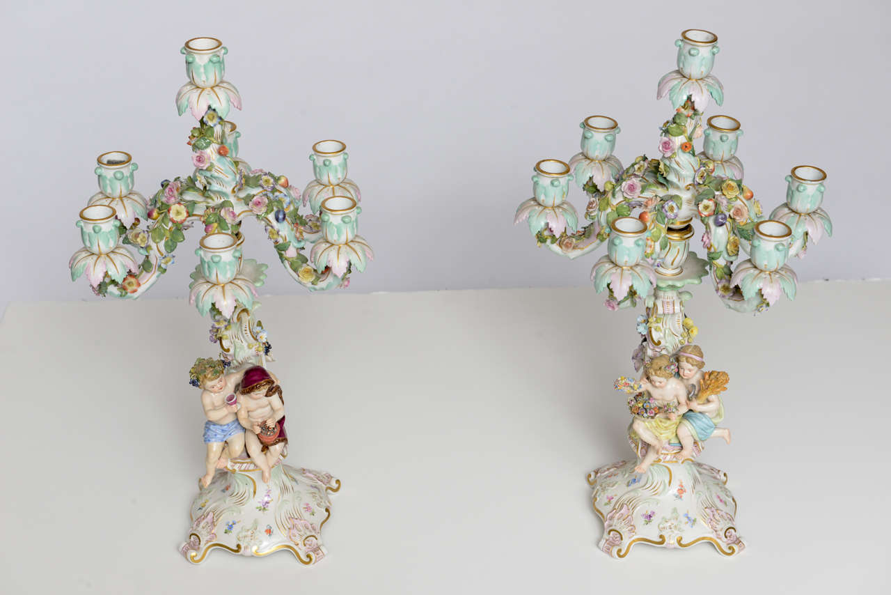 Great Details on these very Fine Hand Painted Meissen Porcelain Candelabras.
When top part is off it becomes a single candle Holder.
  Each Base bears the Manufacture's Signature, the Cross Sword from that period.
