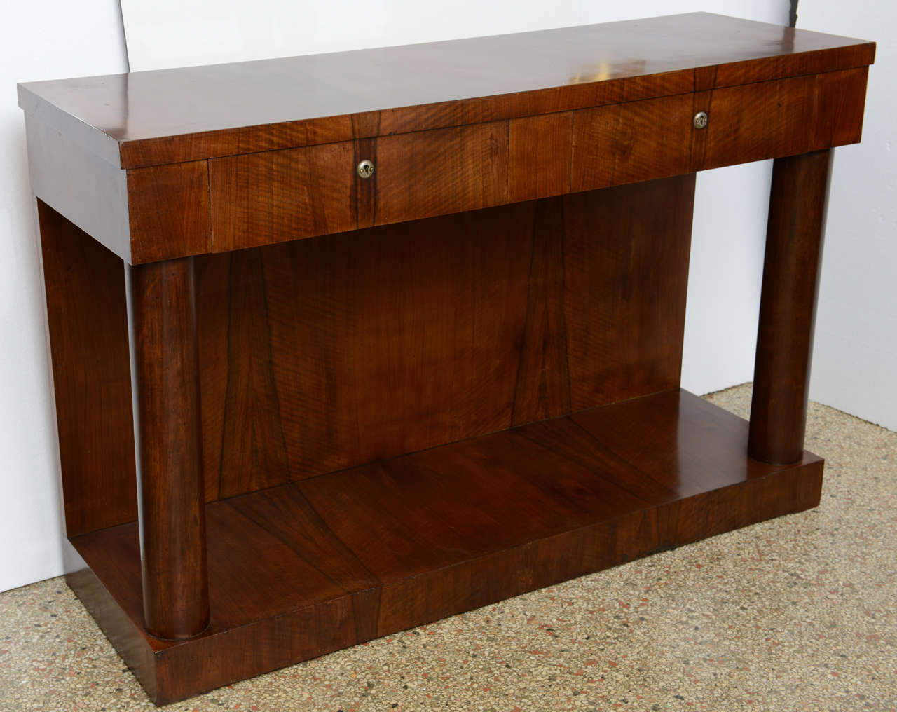 Empire Console/ Server with Two Drawers; hand crafted in figured walnut with bronze mounts on the columns; excellent working surface, original restored finish

Originally $ 7,400.00