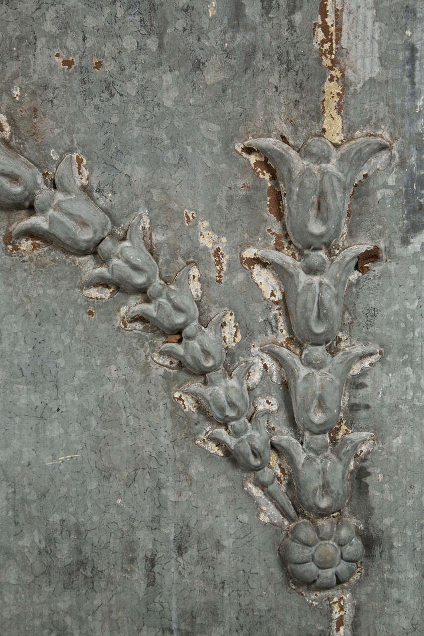 Zinc over-door panel with flower/vine decoration, c. 1880-1900. It is exceptional as a wall hanging, large headboard, jardiniere front, etc.