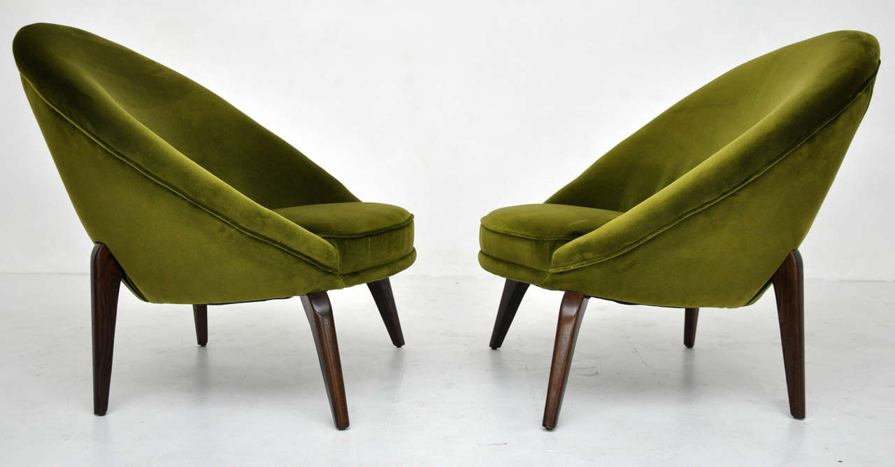 French egg chairs in manner of Jean Royere.  Newly upholstered in green cotton velvet.  Fully restored walnut finish legs.