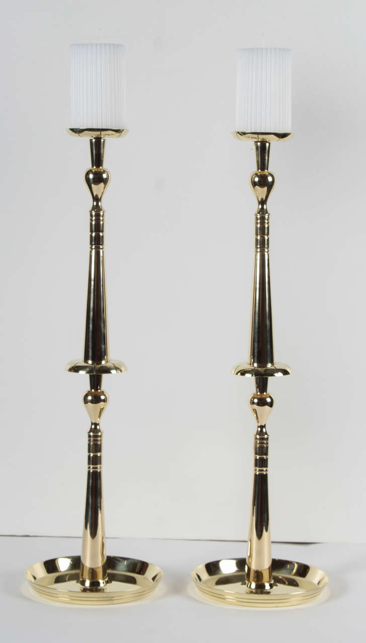 Exceptional pair of Mid-Century Classic and elegant brass candlesticks by Tommi Parzinger.