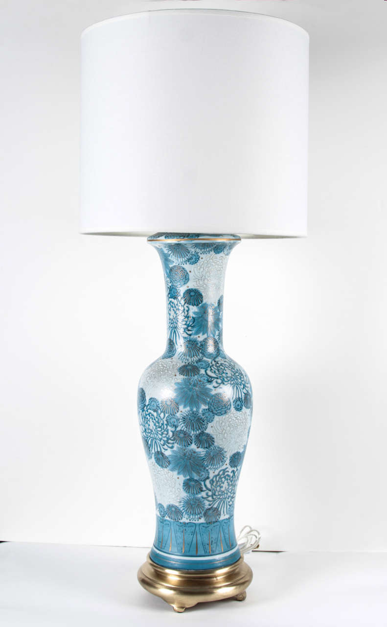 Pair of porcelain lamps with the Classic blue chrysanthemum pattern on satin brass bases by Marbro.