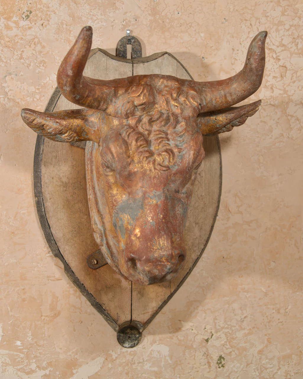 19th c. zinc cow's head from France with wooden plaque.
Has traces of gold leaf.