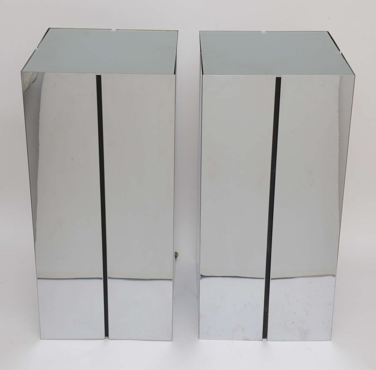 Pair of chromed steel illuminated pedestals with frosted glass tops designed by Neal Small for George Kovacs.

Note: One of the glass tops has a small chip on the underside, which is right above one of the interior braces. See image #10

Note: