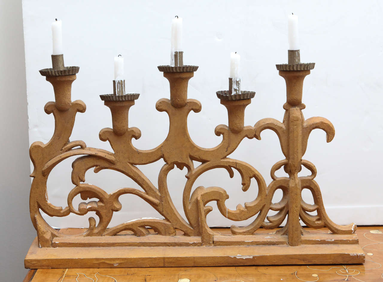 Two, left and right, hand-carved and gold gilded, foliate candelabras.