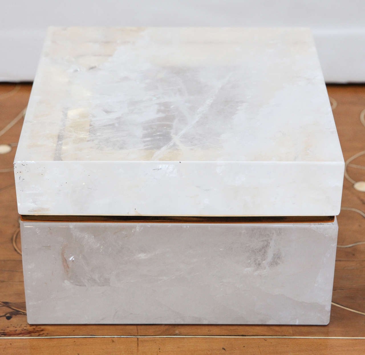 Striking, hand-carved, lidded, rock crystal box with gilded lip.