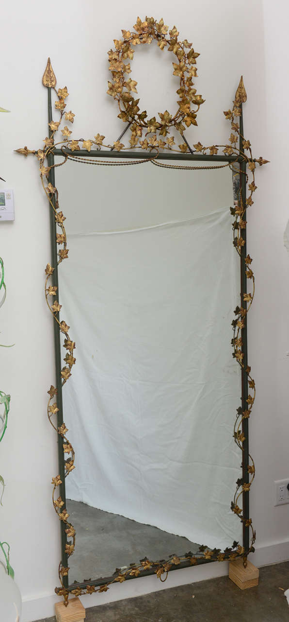 Large mirror with very decorative ivy motif.