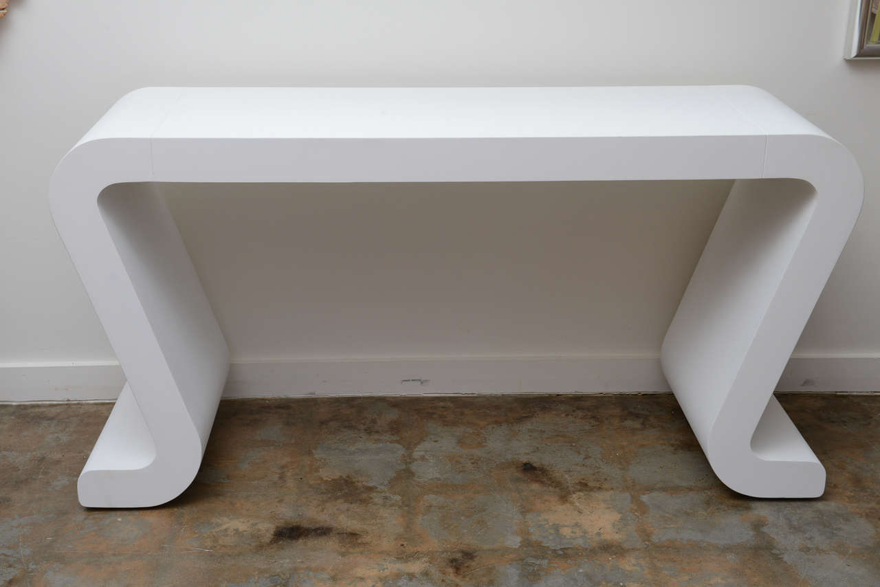 Mid century modern wooden 'wave' console with white primer.