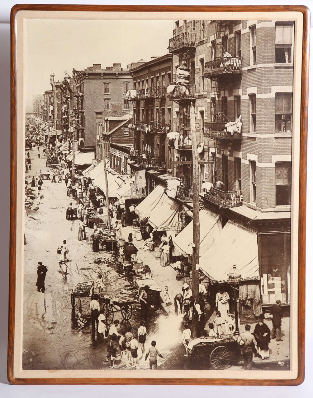 The hustle and bustle of New York captured in a 1901 photograph of the Lower East Side in Manhattan Taken by unknown photographer, the image depicts the unrelenting, yet frivolous vitality of the city that has not yet waned over more than a century.
