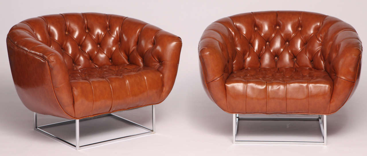 Pair of Brown leatherette, tufted barrel back club chairs by Milo Baughman. Extremely comfortable to lounge in and will make you feel as cool as their chrome frames.