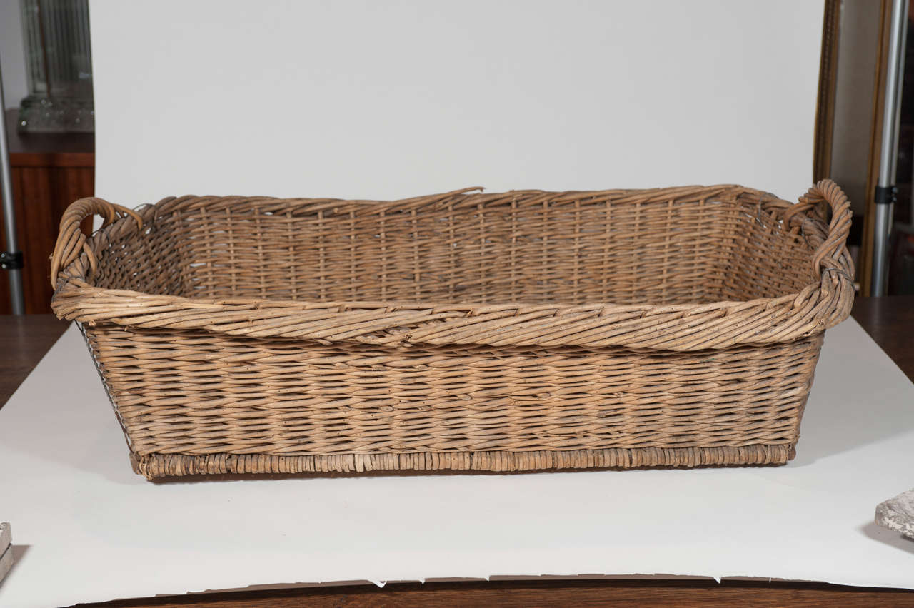 19th Century Antique Large Wicker Basket with wooden foot strapping
France circa 1890