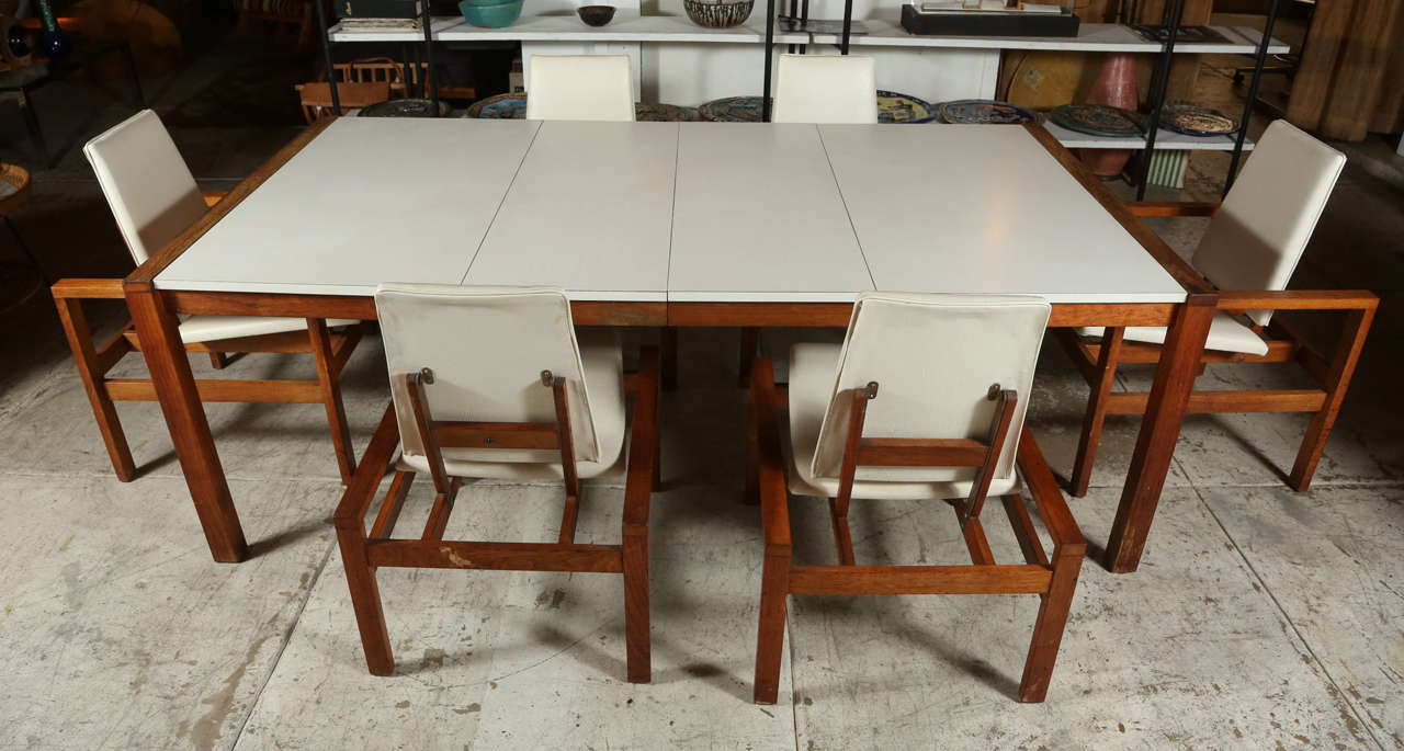 A walnut, laminate and vinyl dining set by Martin Borenstein for Brown Saltman from the variations collection c.1959. Has two additional leaves.