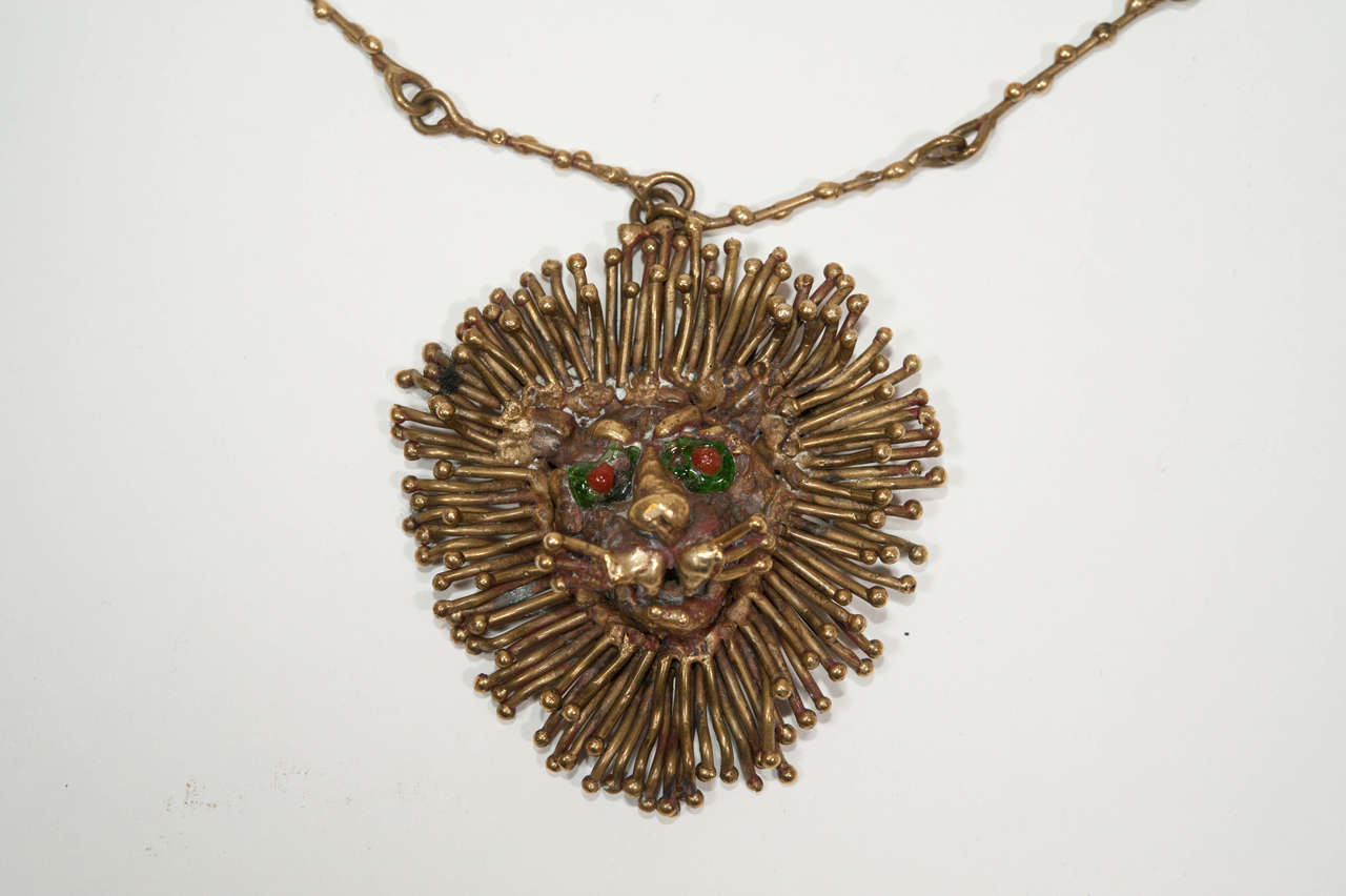 Sculptural bronze necklace, lion face with red stone eyes.
Signed Pal Kepenyes Mexico
overall length: 15''