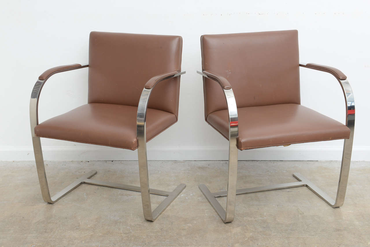 These are labeled by Knoll and probably date back to the 1960, s , they still retain they're original coñac leather . However leather has minor scuffs , I would leave them all original and would leave it up to the purchaser to decide . These also