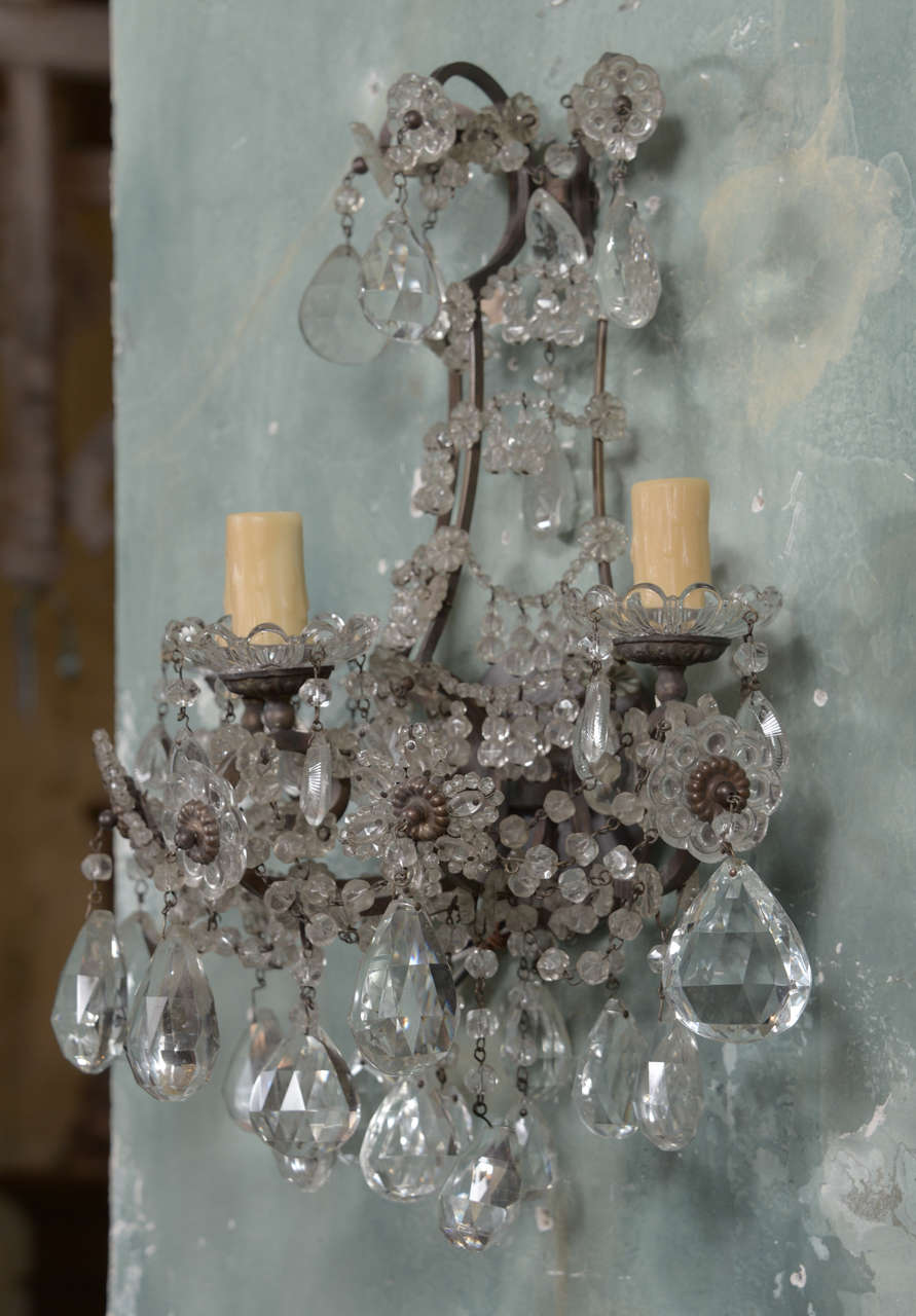 Pair 19th c. iron and crystal sconces . Beautiful crystals. Wired for the US.
