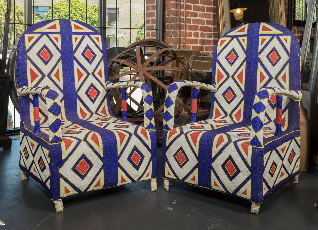 This vibrant pair of beaded chairs comes from the Yorba tribe in West Africa and takes 6 months to make each. They are covered in an intricate diamond pattern.