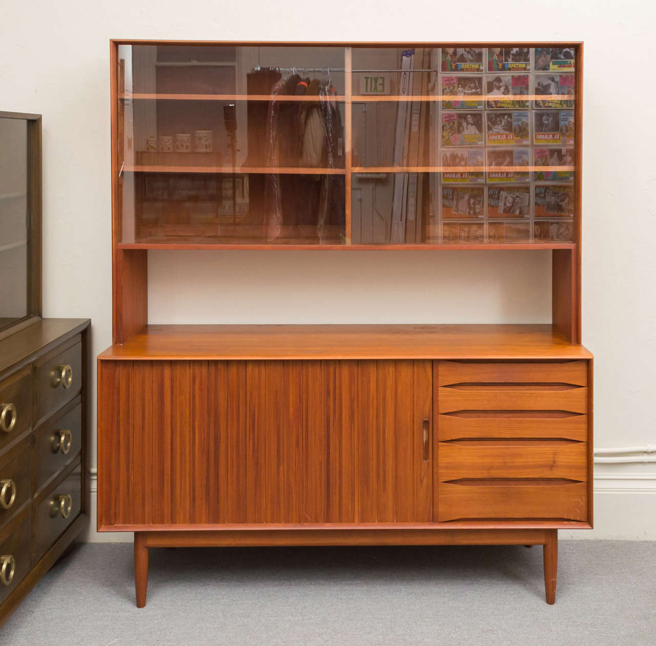 Stunning craftsmanship went into every inch this buffet/credenza.. Wonderful grains in the Teak on the tambour door, the five Teak door pulls, with them showing the size of the drawer, right down to the dovetails joints.  Johannes Aasbjerg's pieces