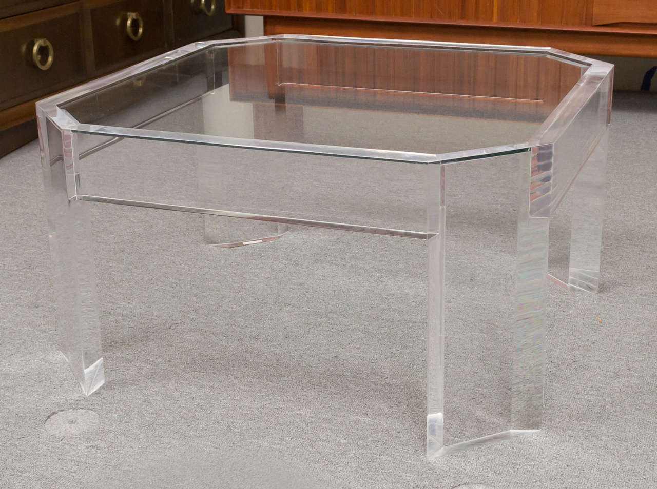 A wonderful octagon shape Lucite coffee table, that could also work as a side. With an inset glass top.
Lucite is thick, about 1 1/2 inches to 2 inches. A nice Charles Hollis Jones design.