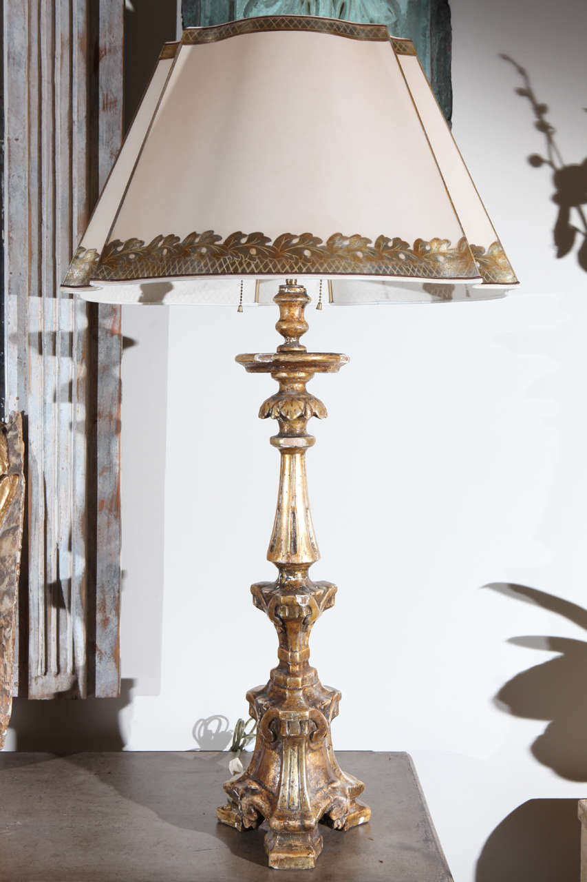 Pair of italian candle sticks wired into lamps with parchment shades