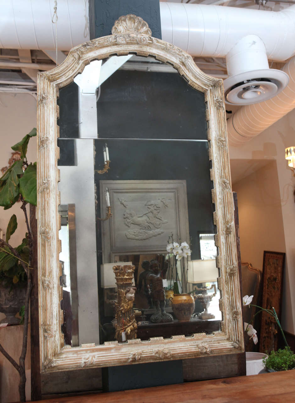 19th c stripped giltwood mirror carved with gesso wash .