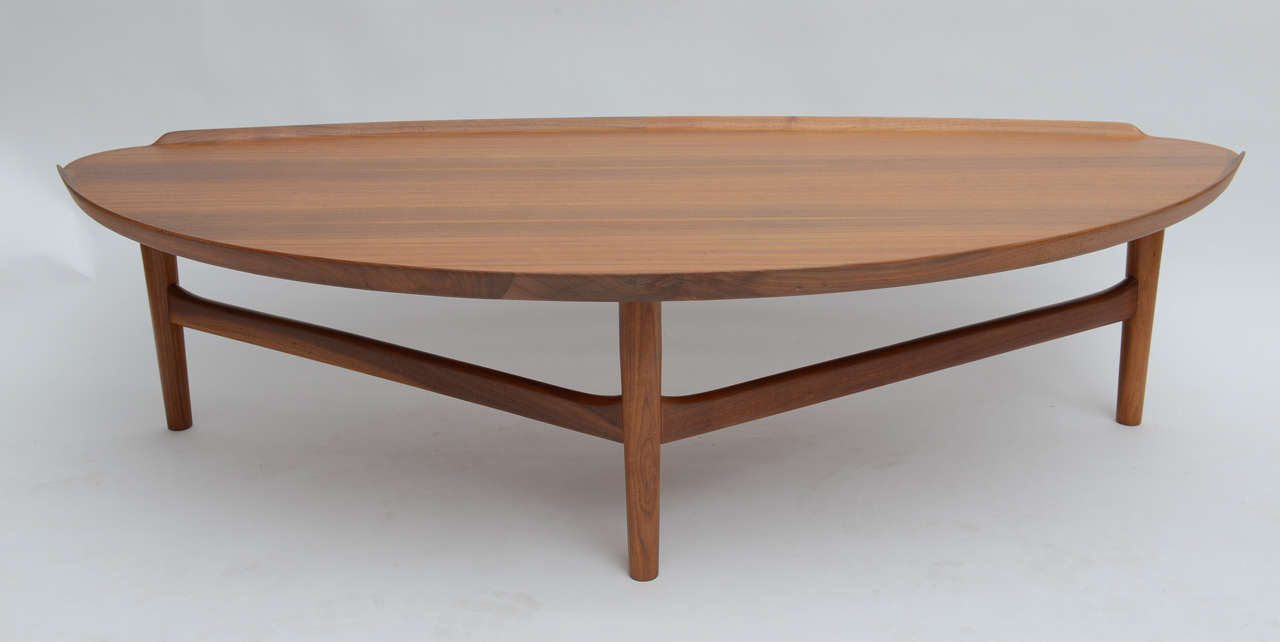 A sculptural coffee table designed by Finn Juhl and manufactured in 1951 as part of the Baker modern furniture line.Baker introduced 24 designs,many of which were showcased at the Moma Good Design Show.