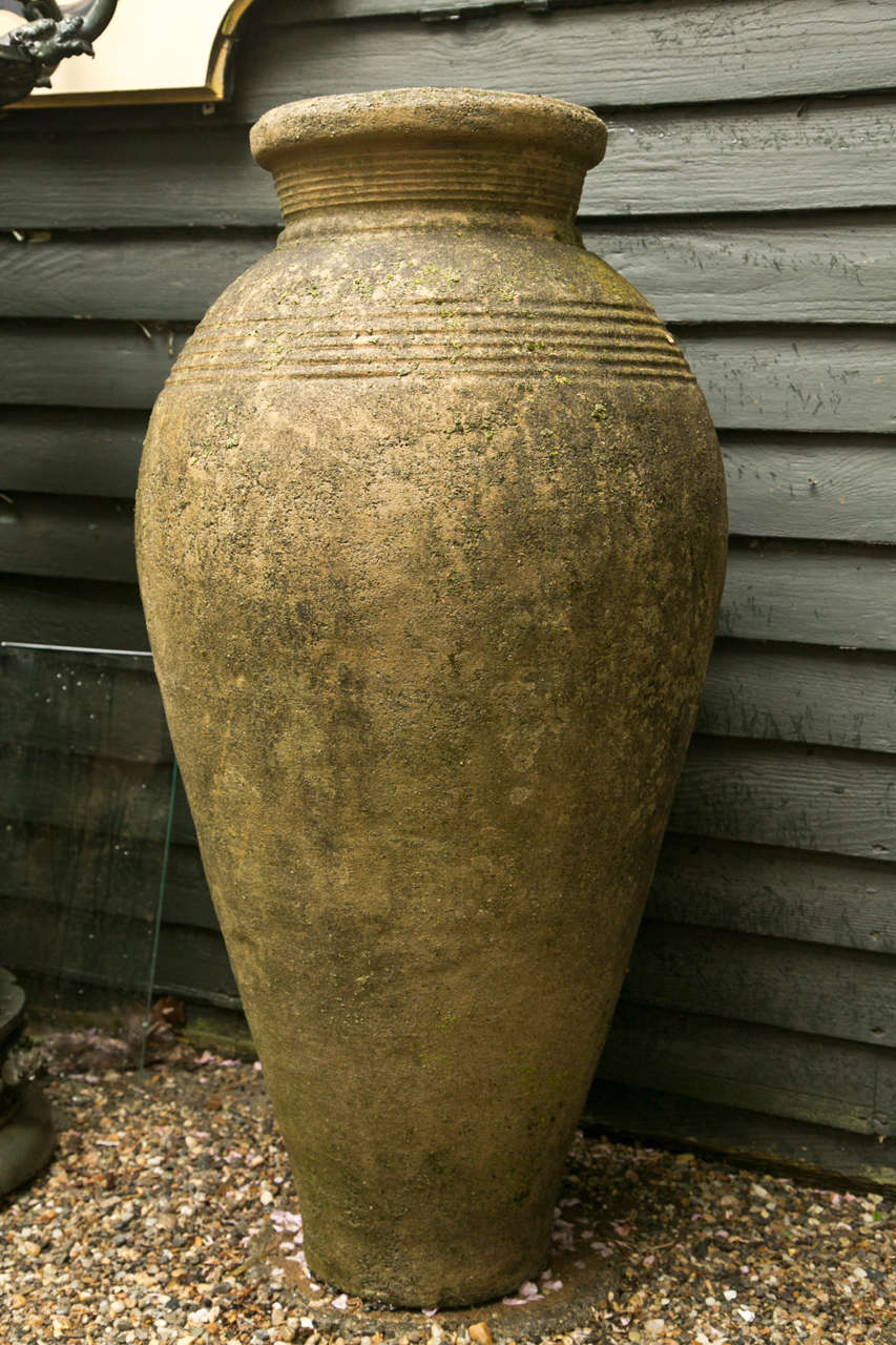 A unique pair of jars with ring decoration. Tapered to the bottom.