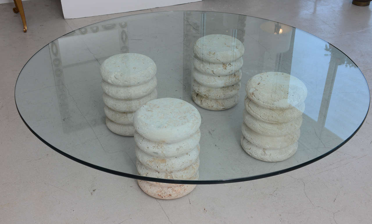Retro coquina stone coffee table with circular glass top. The base comprises four columns which can be arranged in any configuration.