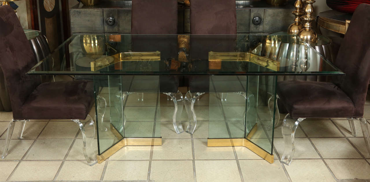 Dining table of brass and glass by Pace.   The 3/4