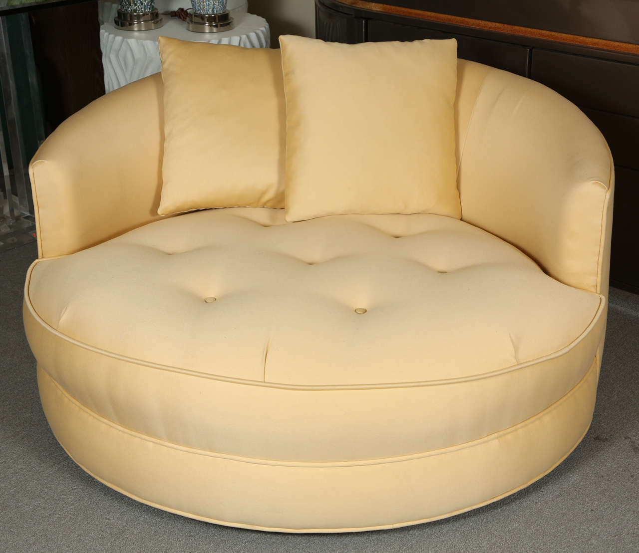 Lovely tufted circular love seat  upholstered in a beautiful butter yellow fabric by 
Milo Baughman