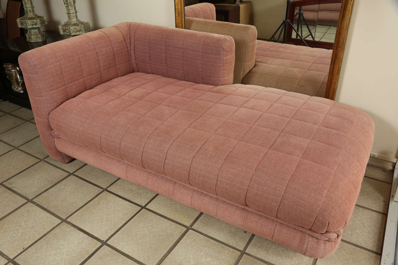 Custom designed chaise lounge by Steve Chase.  The salmon chenille upholstery is original, and there is the design element of a thick knotted holstered cord around the bottom of the seat. there is minimal fading to the reverse side of the chaise.