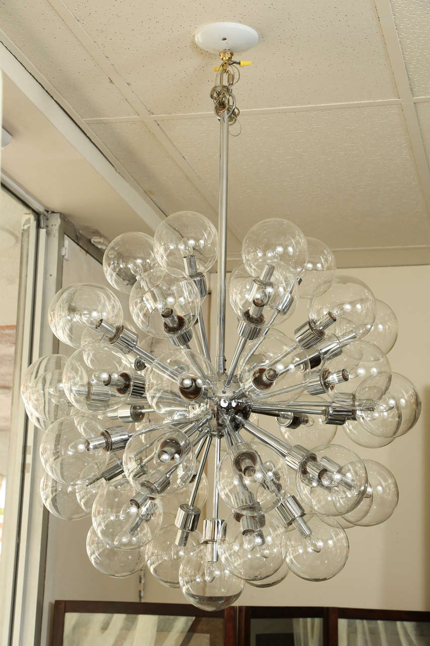 Exceptional pair of identical vintage Lightolier sputniks in a polished chrome finish. Each fixture has 45 lights, and each light source is enclosed in a 6