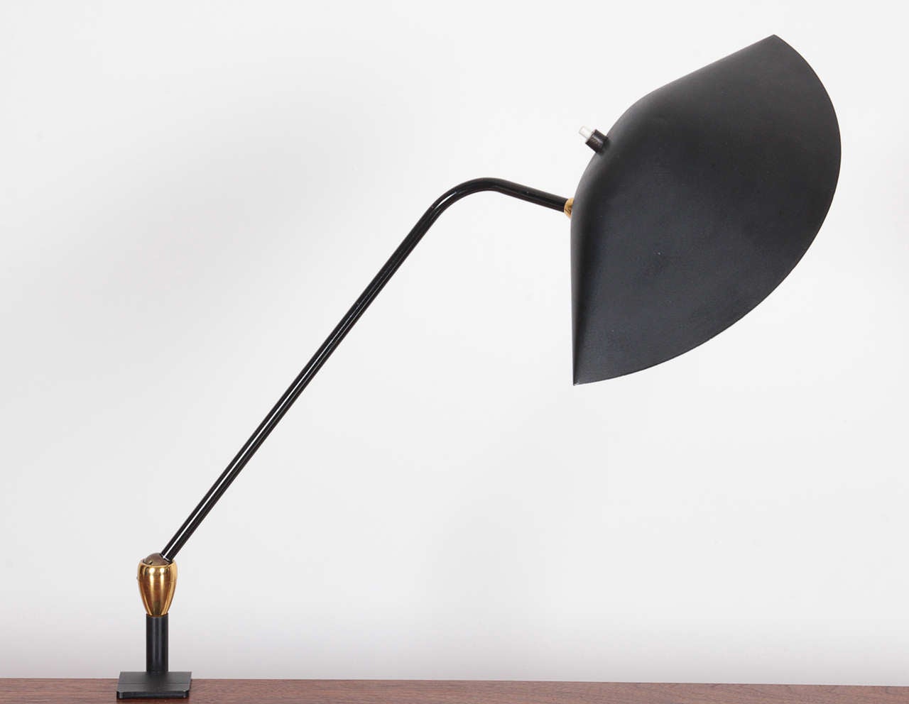 Serge Mouille, 1958, clamp Lamp with two ball and socket joints. Sculpted and painted metal with bronze hardware.