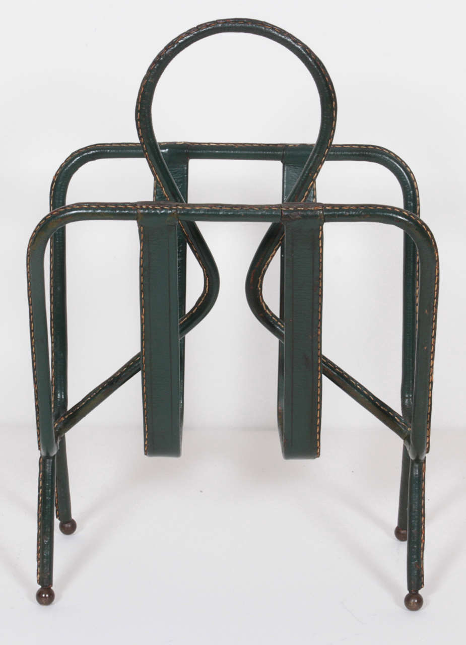 Magazine stand in Tubular Metal, covered in Green Leather top-stitched, bronze detail