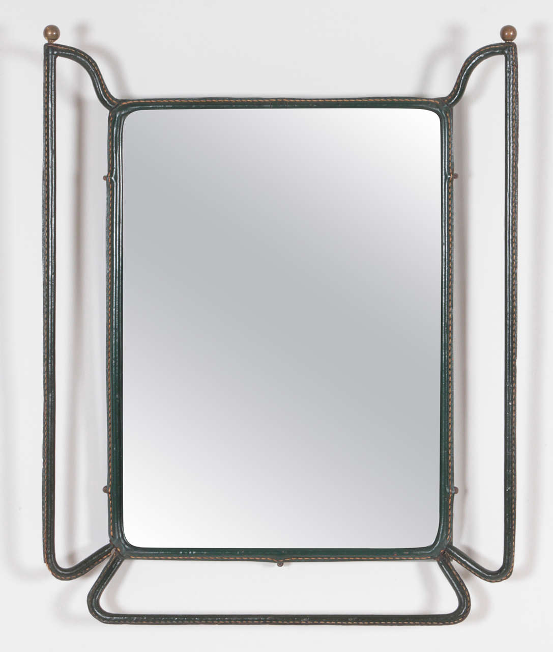 Jacques Adnet, Circa 1950
Mirror frame in Tubular Metal covered in Green Leather with Natural Stitching, Bronze Ball Detail.