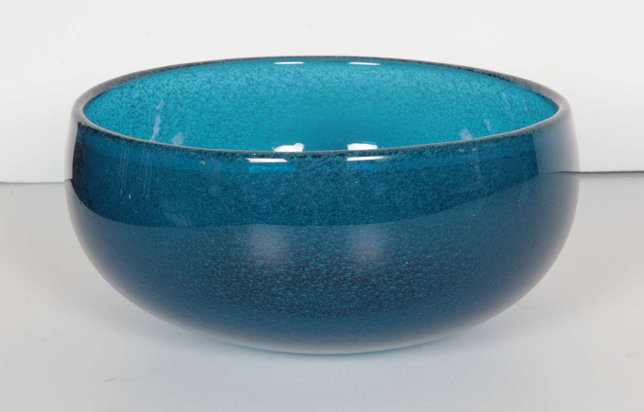A large turquoise glass bowl by Sven Palmqvist with encased bubbles. Signed and numbered on bottom.
