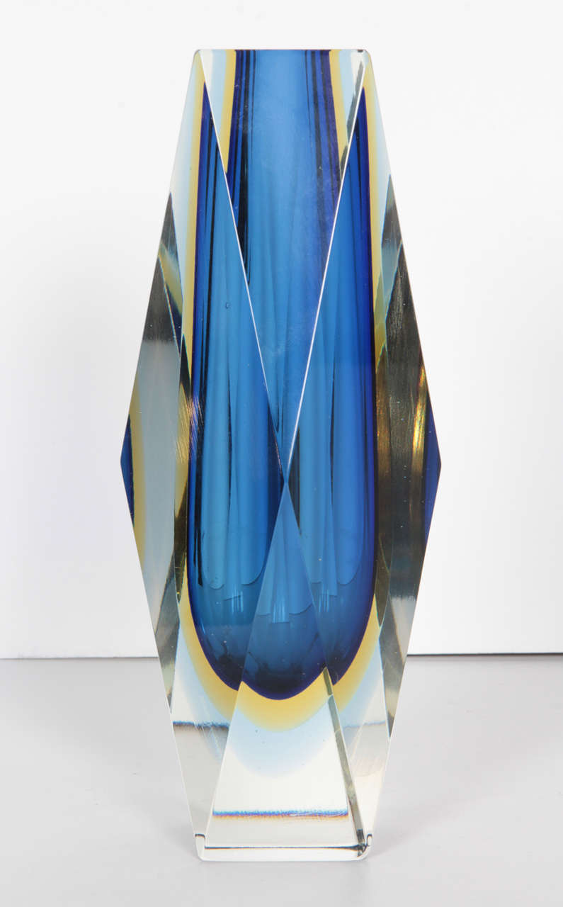 A faceted sommerso Murano vase by Mandruzzato. Blue and yellow, encased in clear glass.