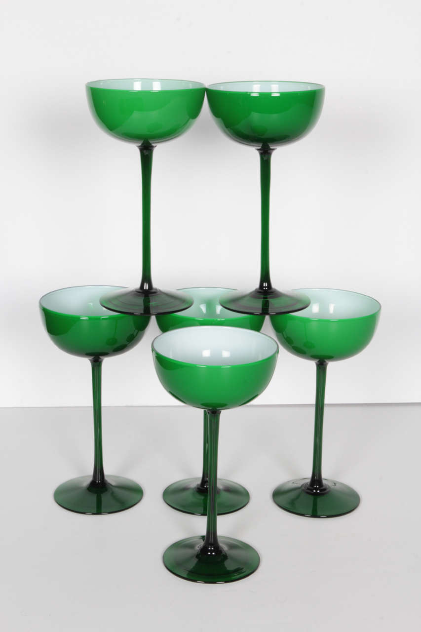 A set of six cased glass cocktail/champagne glasses by Carlo Moretti for Empoli in emerald green with white interior.