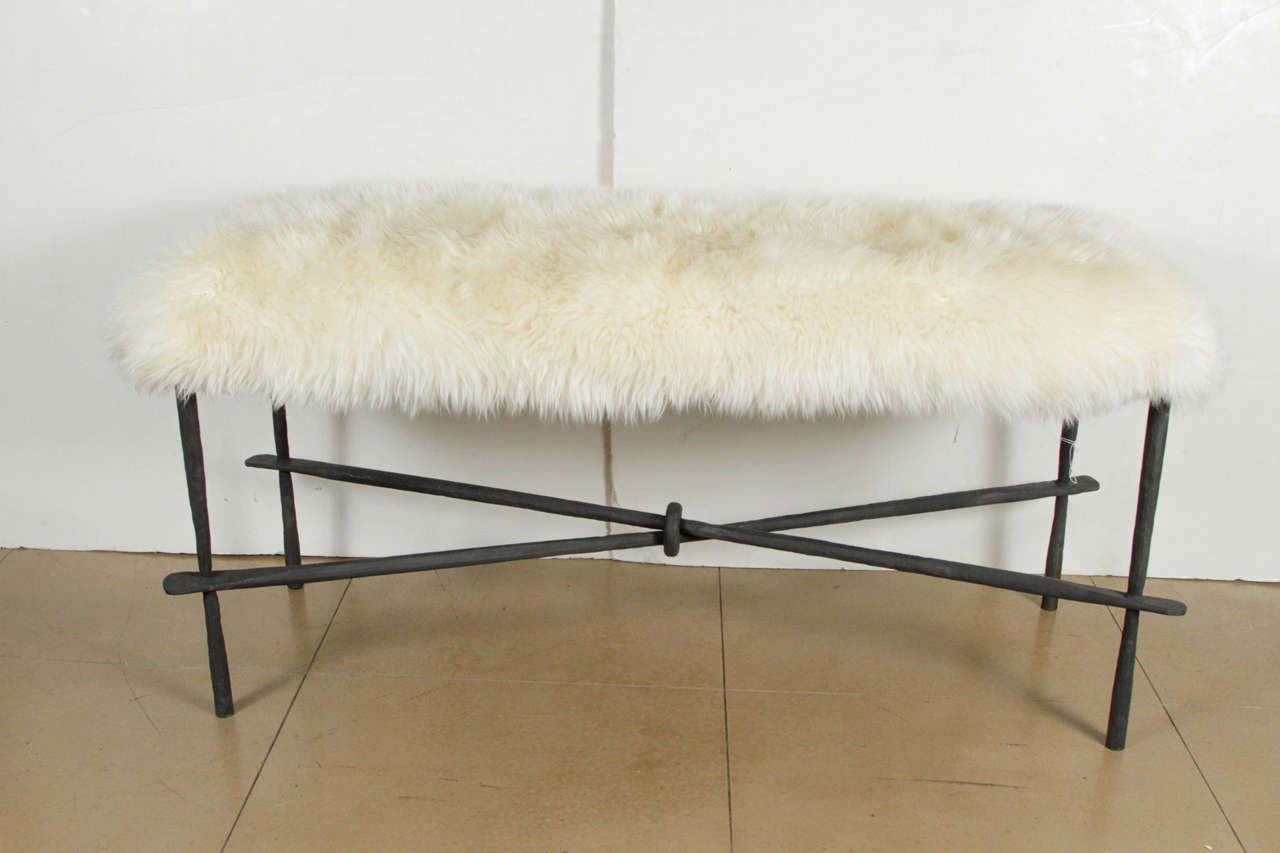 Inspired by Diego Giacometti, this sheepskin pelt bench provides luxurious seating for a bedroom or dressing area. The cast iron legs have been hand-forged adding a refined and masculine detail to the base.
